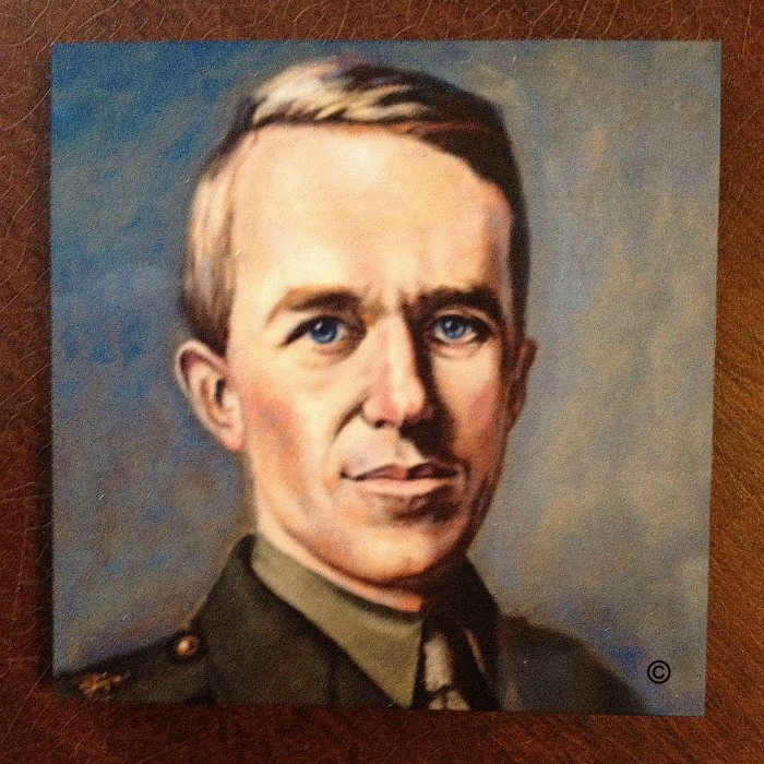 Commemorative fridge magnet of  T E Lawrence in Army uniform against plain background.